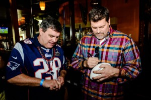 Celebrity guest Mark Schlereth (right) signing autographs  
